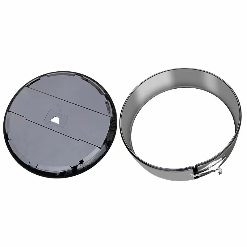 Spare tire circular shape black and stainless steel.