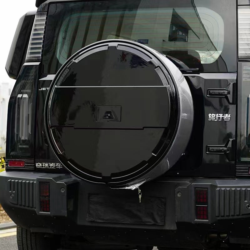 Spare tire circular shape black and stainless steel.